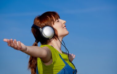 Happy woman listen music clipart