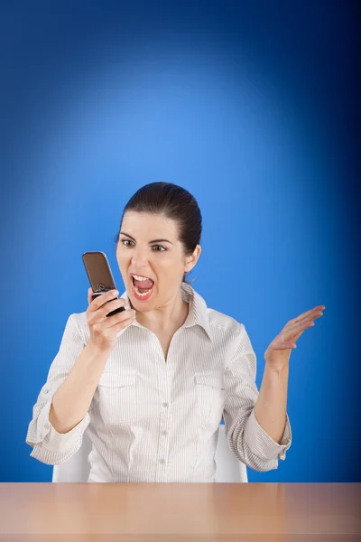 Angry woman calling at phone — Stock Photo, Image