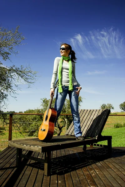 Woman with a guitar — Stock Photo, Image