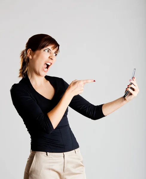Unhappy woman at cellphone — Stock Photo, Image