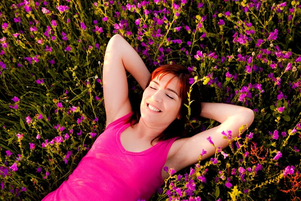 Lying on flowers — Stock Photo, Image
