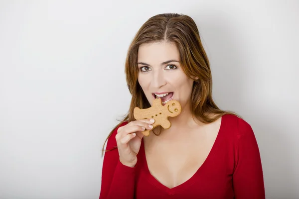 Bitting a Gingerbread cookie — Stock Photo, Image