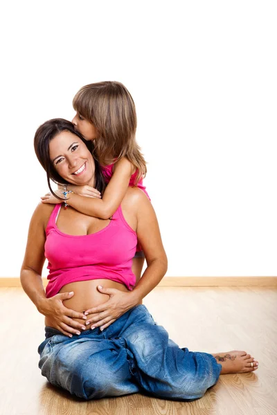 Mujer embarazada con su hija —  Fotos de Stock