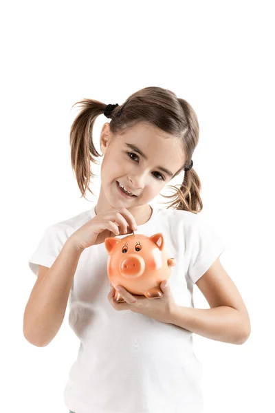 Menina com um porquinho-banco — Fotografia de Stock