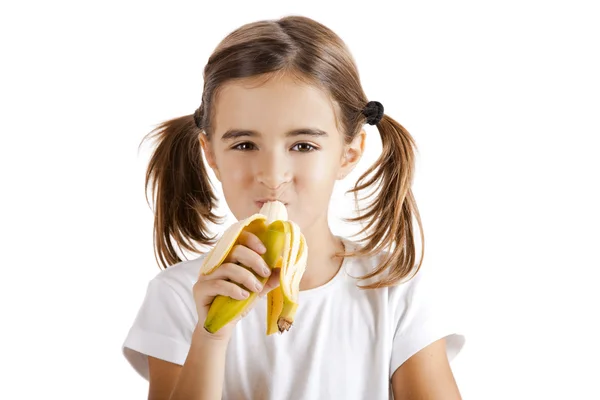 Съесть банан — стоковое фото