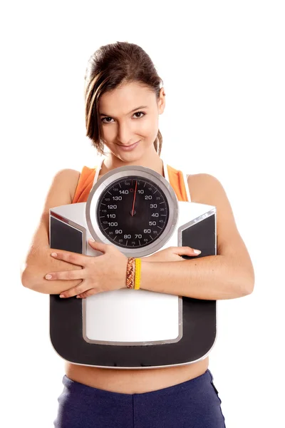 Athletic girl with a scale — Stock Photo, Image