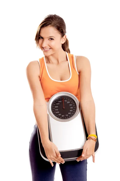 Athletic girl with a scale — Stock Photo, Image