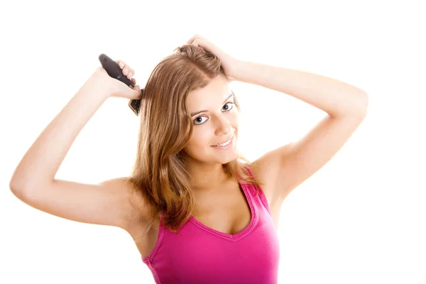 年轻女人梳子头发 — 图库照片
