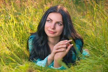 Young woman in grass clipart