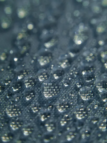 stock image Water bubbles on fabric