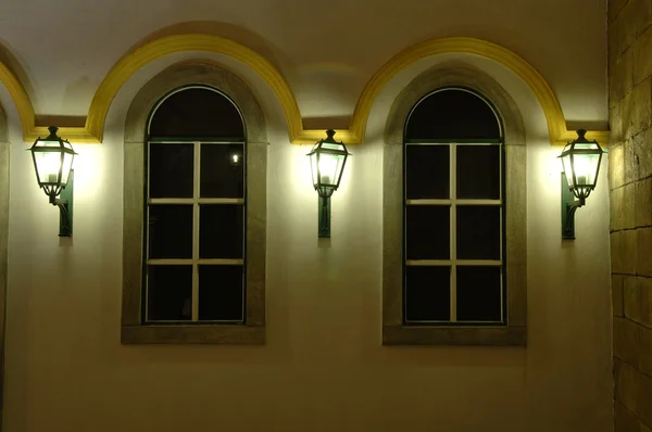 Facade of windows and antique lanterns — Stock Photo, Image