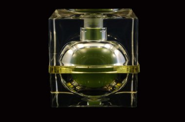 Bottle of perfume over black background