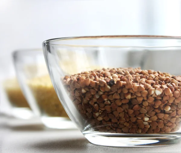 stock image Buckwheat, couscous and rice in glass