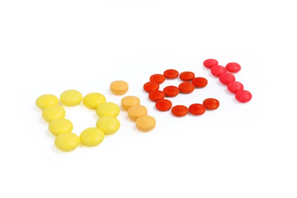 Цвет таблетки диета текст — стоковое фото
