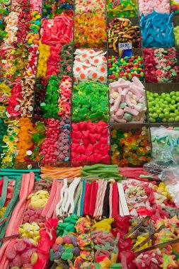 Colourful candies on a market clipart