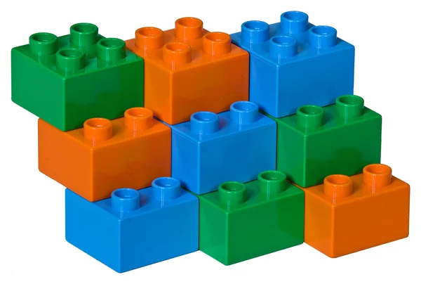 Modré, zelené a oranžové plastové hračky cihla — Stock fotografie