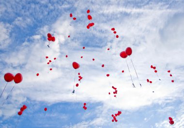 Red balloons flying to the sky clipart