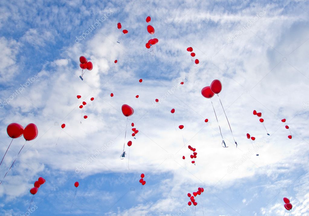 Red balloons flying to the sky