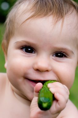 Baby with cucumber clipart