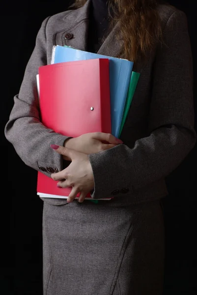 Business woman with red and blue folders — Stock Photo, Image
