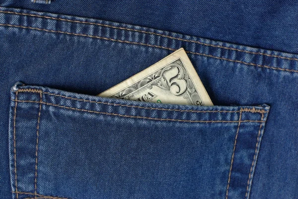 Five bucks in jeans pocket — Stock Photo, Image