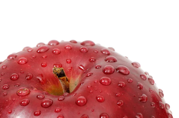 Μήλο με σταγόνες του νερού σε λευκό φόντο — Stockfoto