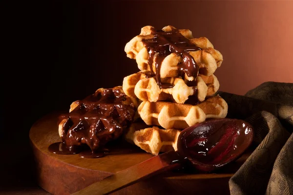 Chocolate syrup and Belgian waffles — Stock Photo, Image
