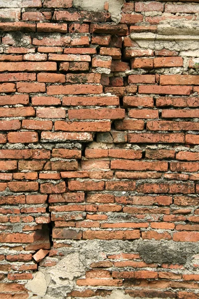 Staré popraskané cihlová zeď texturu pozadí — Stock fotografie