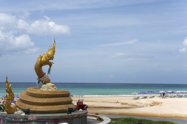 Karon beach naga statue clipart