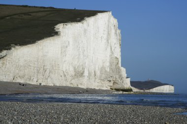 Seven sisters chalk cliffs pebble beach clipart