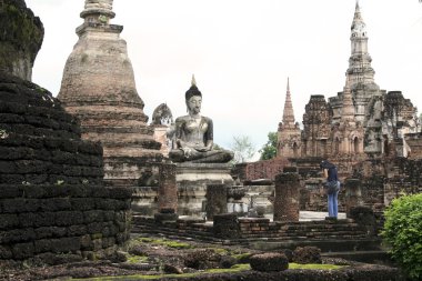 Thai woman praying sukothai buddha clipart