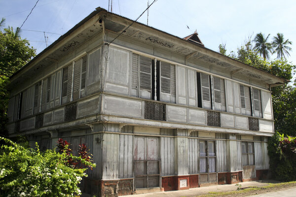 Traditional filipino wooden house in bad state of repair on camiguin island in the philippines