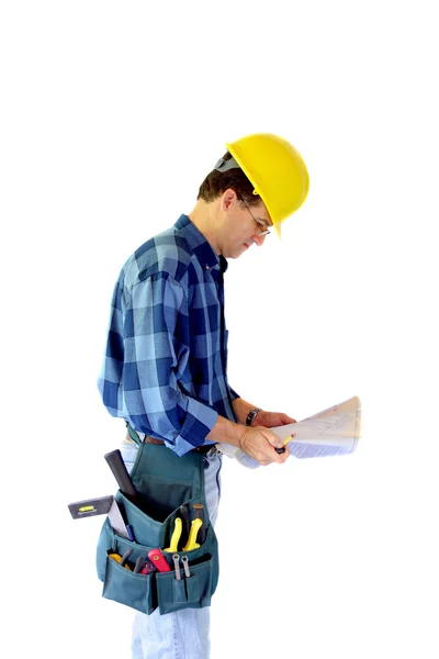 Contractor checking out blueprints Royalty Free Stock Images