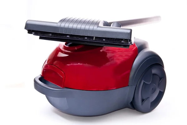 Red vacuum cleaner and brush — Stock Photo, Image
