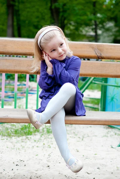 Girl on a bench — Stock Photo, Image