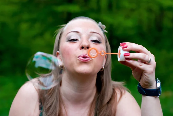 stock image Woman making bubbles