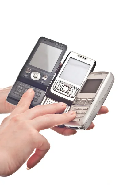 Drie mobiele telefoons — Stockfoto