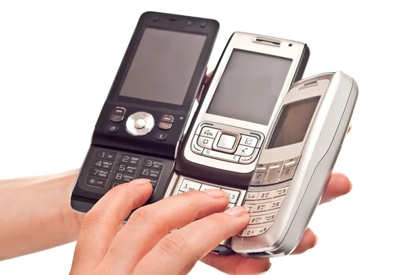 Tři mobilní telefony — Stock fotografie