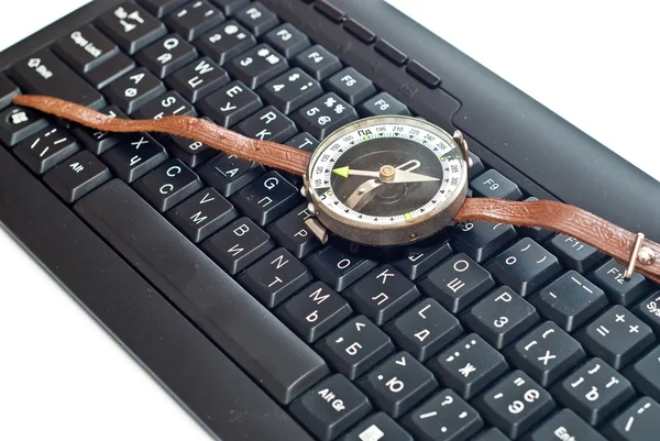 Compass on keyboard — Stock Photo, Image