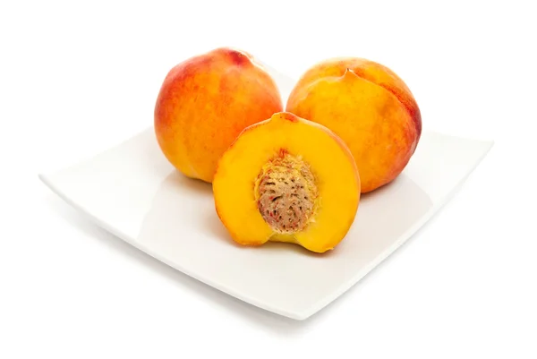 Peaches on plate — Stock Photo, Image