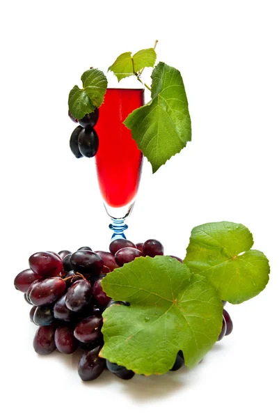 stock image Red wine and grapes