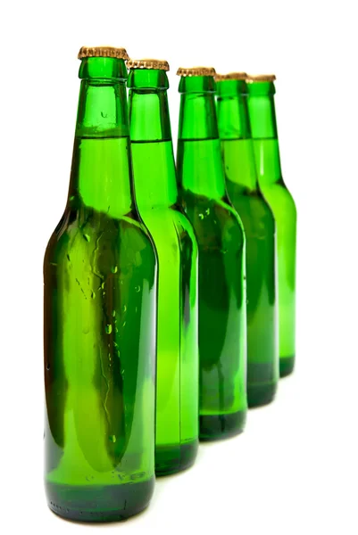 Fila da bottiglie di birra — Foto Stock