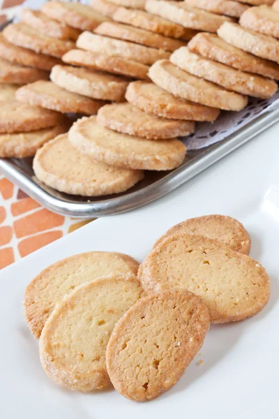 Stock image Pastry cakes with sugar on plate.