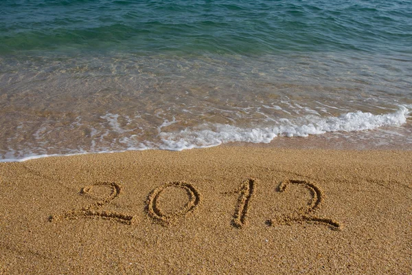Rok 2012 napisane na piasku — Zdjęcie stockowe