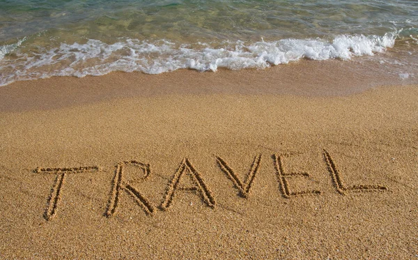 stock image Word travel on the beach.