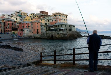 Fishing at sunset - Genoa clipart