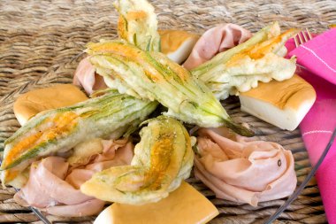 Closeup Of Plate With Fried Zucchini Flowers clipart