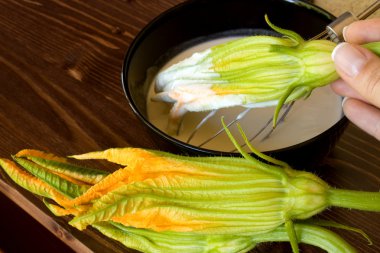 Preparing Fried Zucchini Flowers clipart