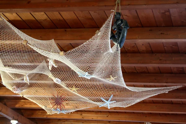 Stock image Fishing Net On Wood Ceiling