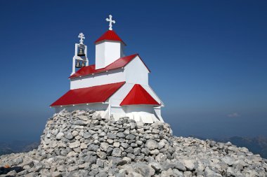 Little church at top of the mountain clipart